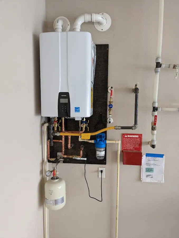 Professional plumber installing copper piping in a Cartersville home